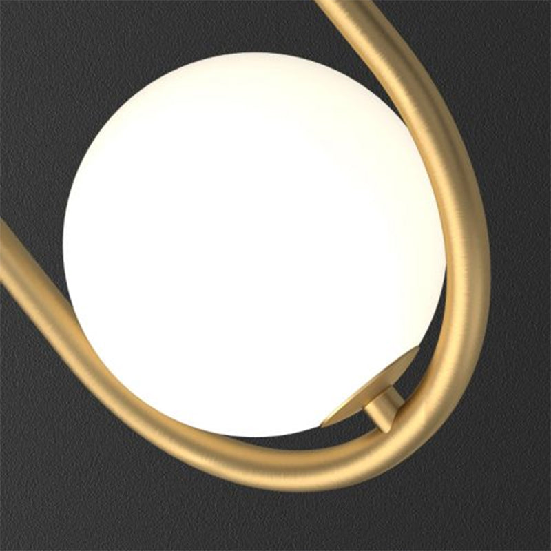 Lampada da tavolo con 2 sfere - finitura dorata con paralume in vetro e struttura ovale