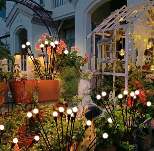 Iluminação solar de jardim - Luz giratória Starburst, a rodar com o vento