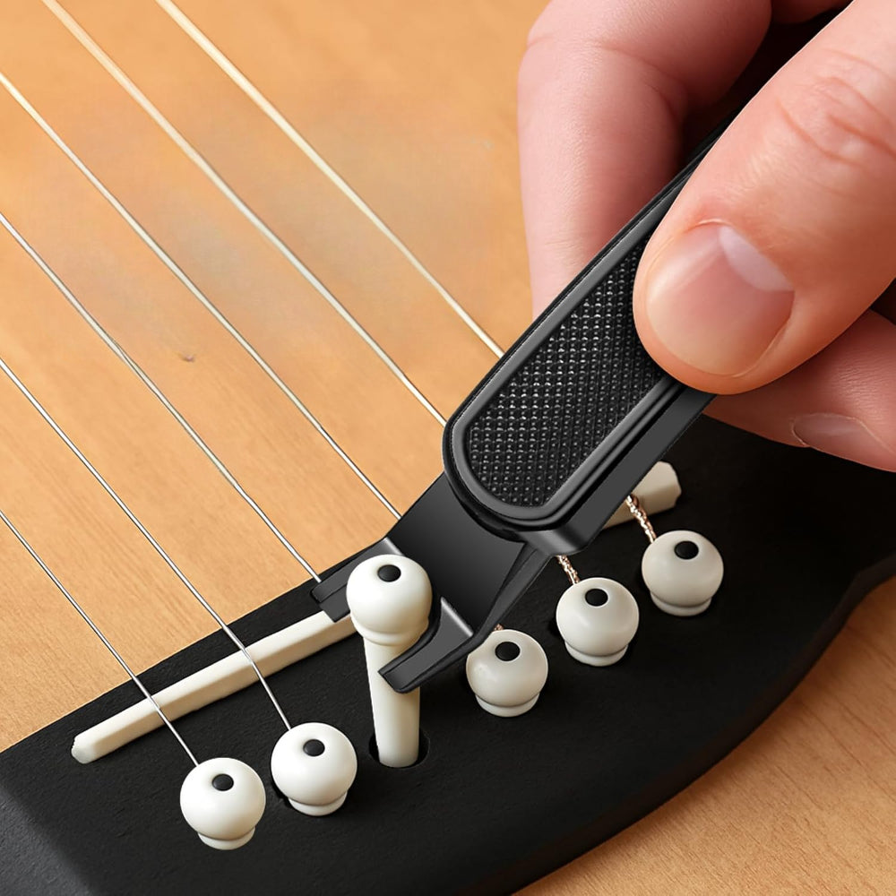 Strumento per la manutenzione e la sostituzione delle corde della chitarra