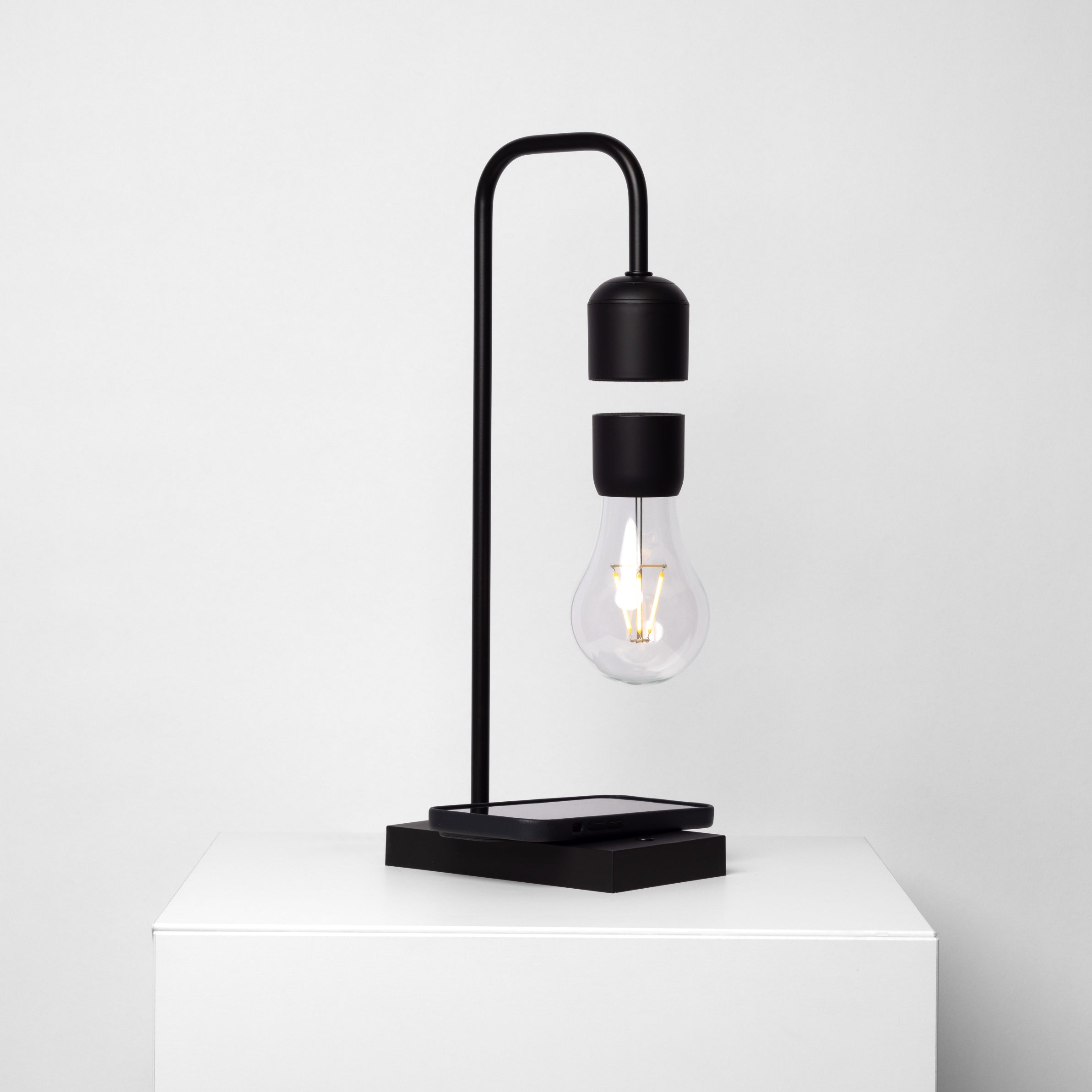 Lámpara LED flotante minimalista con cargador inalámbrico para teléfono